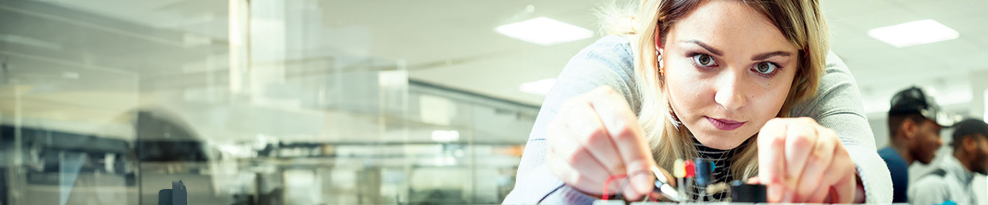 Woman conducting an electrical experiment