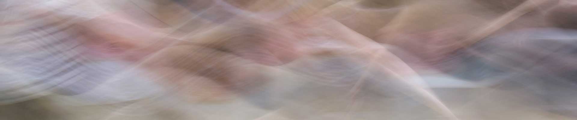 an image of colourful smoky patterns representing movement such as dance