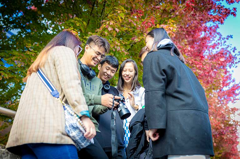 Coventry University students reviewing recent shots on DRSL camera