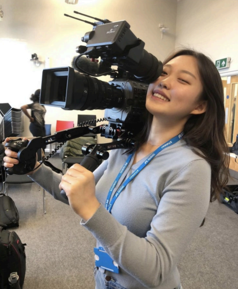 Juyoung Kim holding a Film Camera