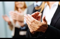 Business people clapping to celebrate an achievement