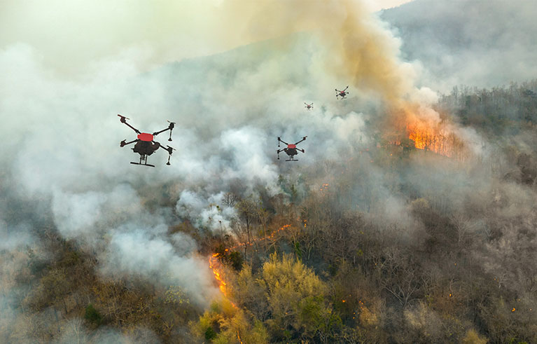 Firefighting drones spray chemical to help control wildfires