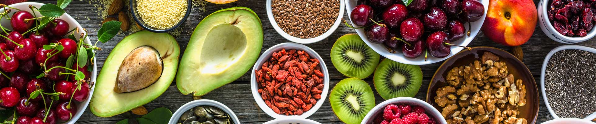 table full of colourful fruits, nuts and berries