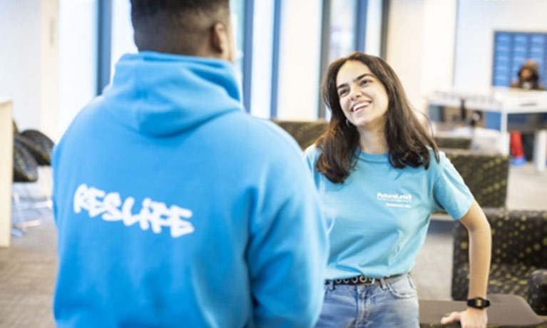 Student talking with a student ambassador