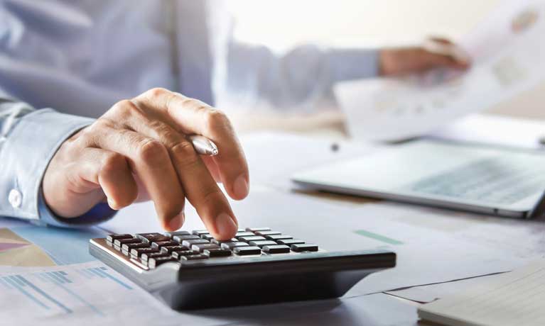 a financial planner calculating expenses