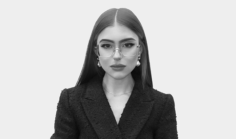 A portrait in black and white of Francheska with a plain background