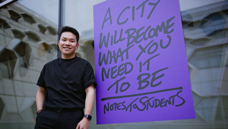 student leans to the window