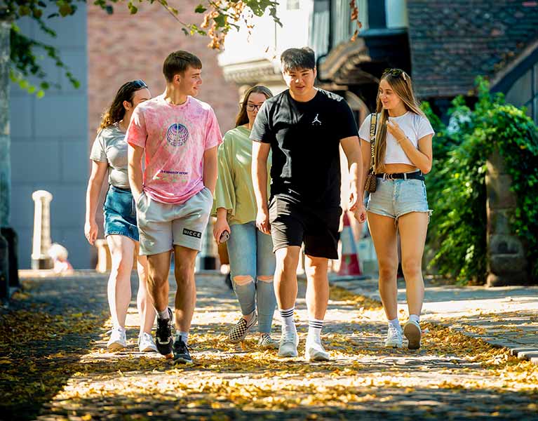 student presenting to peers in a seminar room