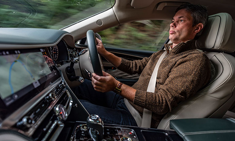 Andrew Noakes driving a car looking through the windscreen