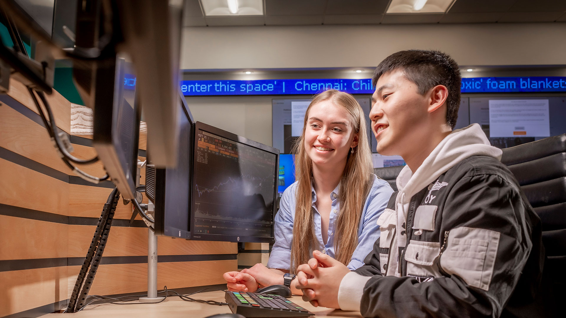 Student looking at multiple screens 