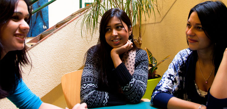 Students chatting in an informal setting.