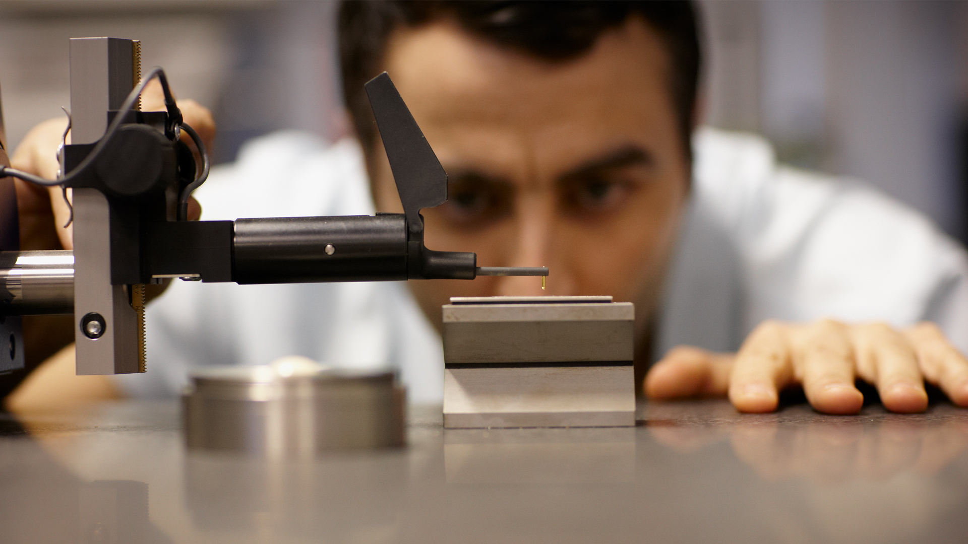 Close up of student using metrology tools