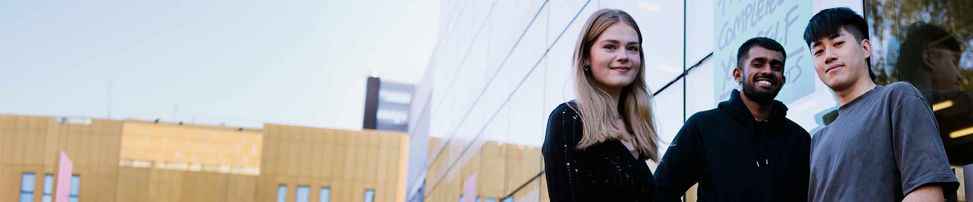 students standing infront of the student hub