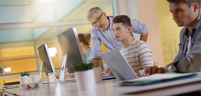 lecturer teaching a young male 