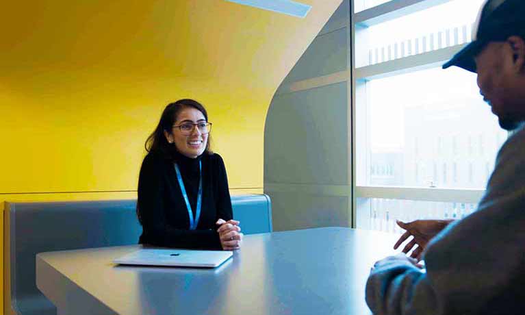 course interviewer smiling at a applicant 