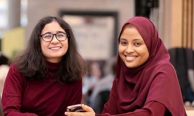 Students walking outside the Student Hub 