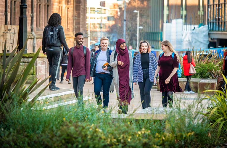 Media and communications students walking together