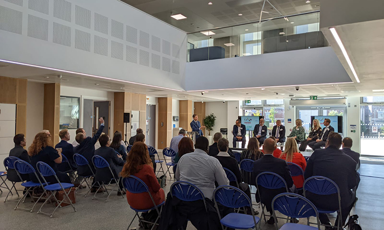 The panel and guests seated in Coventry University's Beatrice Shilling building for the Business Insider breakfast event