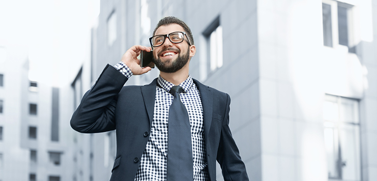 Young man in suit on mobile phone