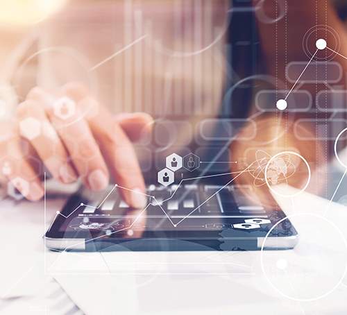 Close up of a hand using a tablet computeto look at a graph