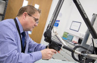 Lecturer adjusting a microscope