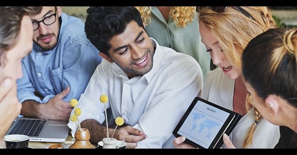 Students looking at a tablet presentation