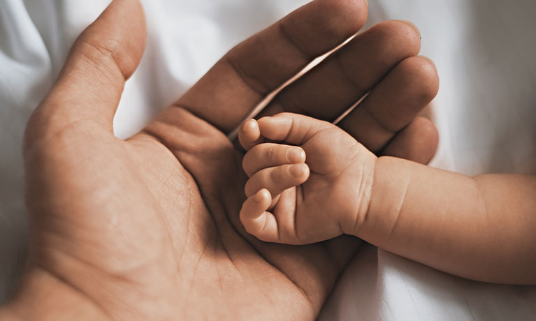 Mother and baby hands