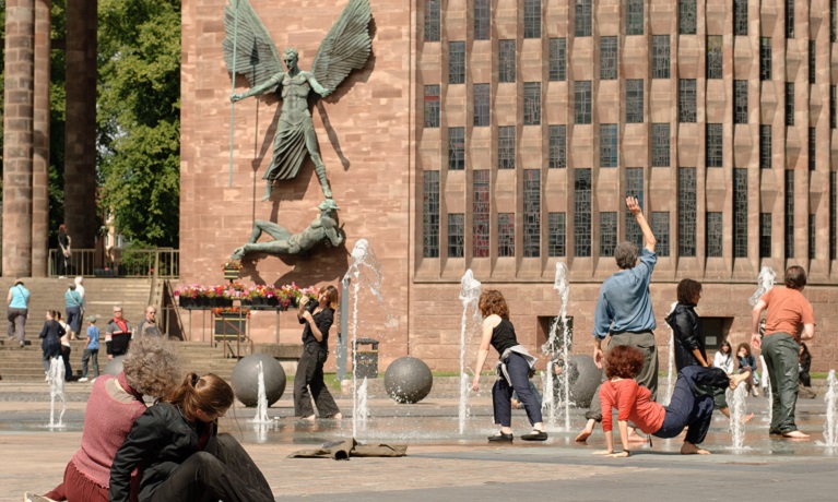 Coventry Dancer outside cathedral.