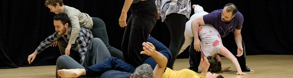 Dancers moving on a studio dance floor