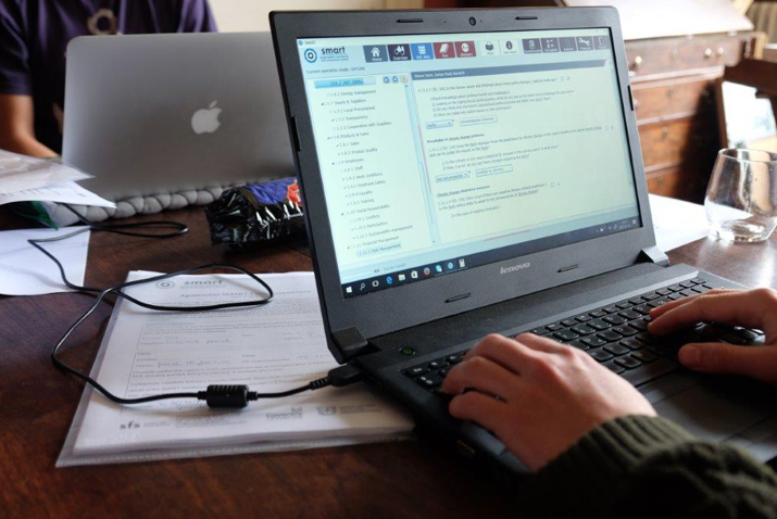 two people working on laptops