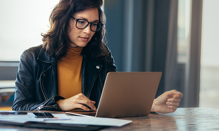 A lady working on a laptop