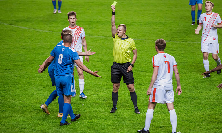 Referee managing a football game