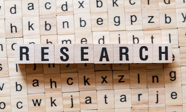 Research written in wooden letters