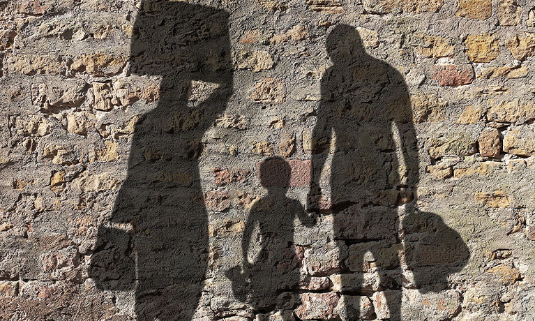 Refugee shadows on wall 