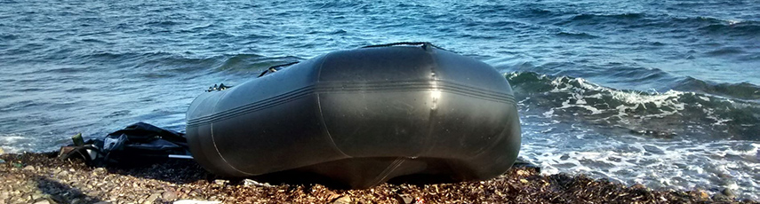 Empty dinghy washed up on a beach