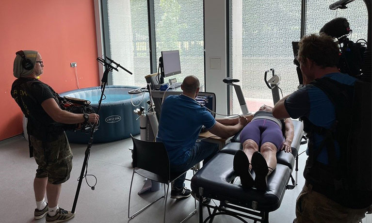 Researchers in room with hot tub