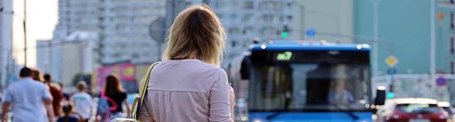 A lady waiting for a bus