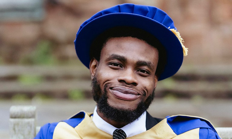Dr Cherisse Hoyte, pictured against the Coventry skyline with the Cathedral behind her.