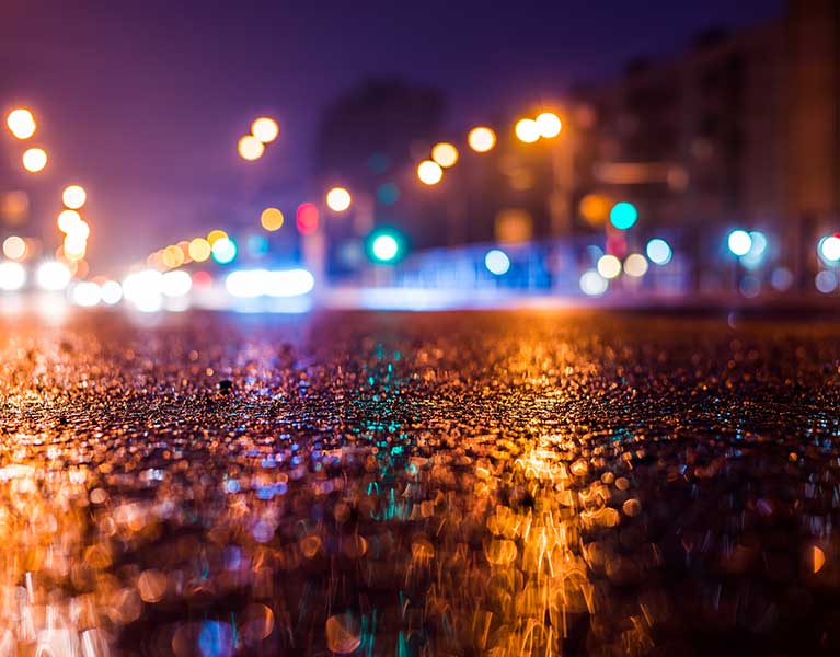 road at night with lights in distance