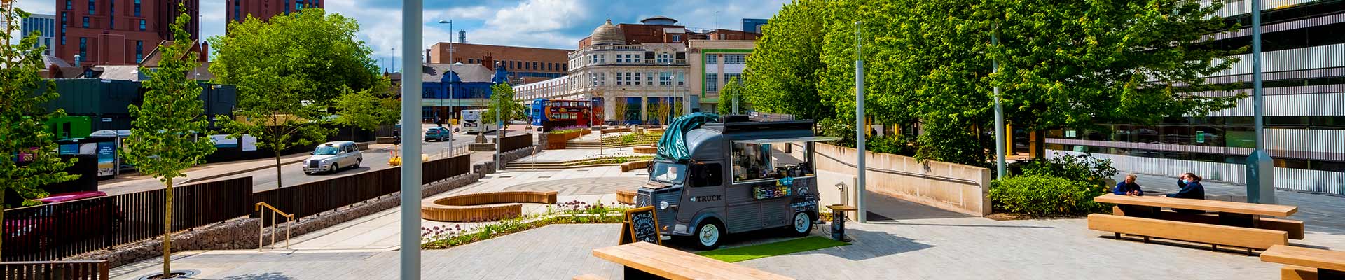 campus grounds outside on a sunny day with green trees
