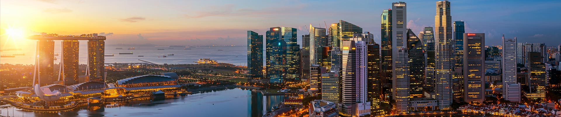 Skyline view of skyscrapers in Singapore at night.