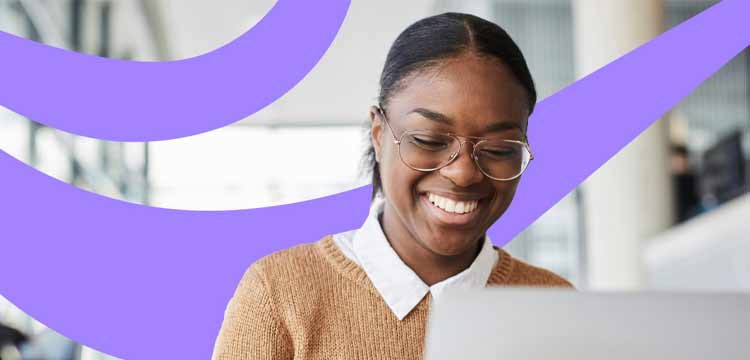 Smiling female wearing glasses looking at a laptop with graphic lavender swirl in background