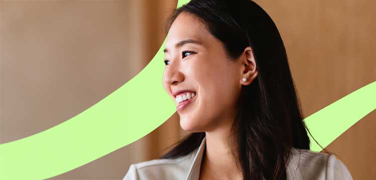 Smiling female with long dark looking to the right 