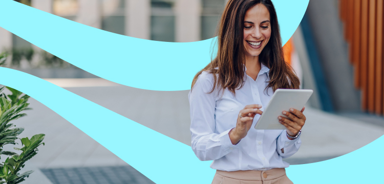 Smiling female with long brown hair looking at a tablet