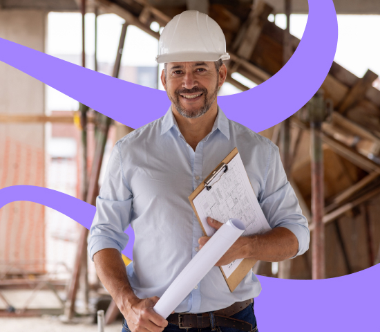 Person in a white hard hat and light blue shirt holding a clipboard and rolled-up document at a construction site with scaffolding in the background.
