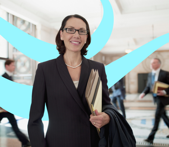 Person in a suit holding folders and a jacket, with blurred figures and a blue abstract overlay in the background.