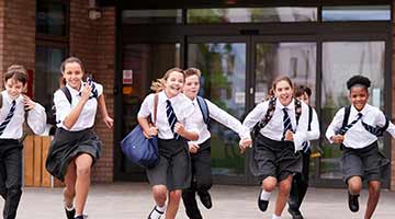 Group of school children running