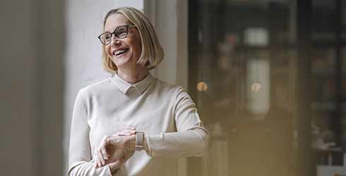Older lady checking her watch looking to the left