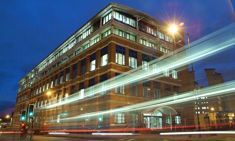 William Morris building in the evening with blur motion of car lights