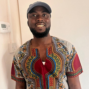 Portrait of Mohammed smiling at the camera